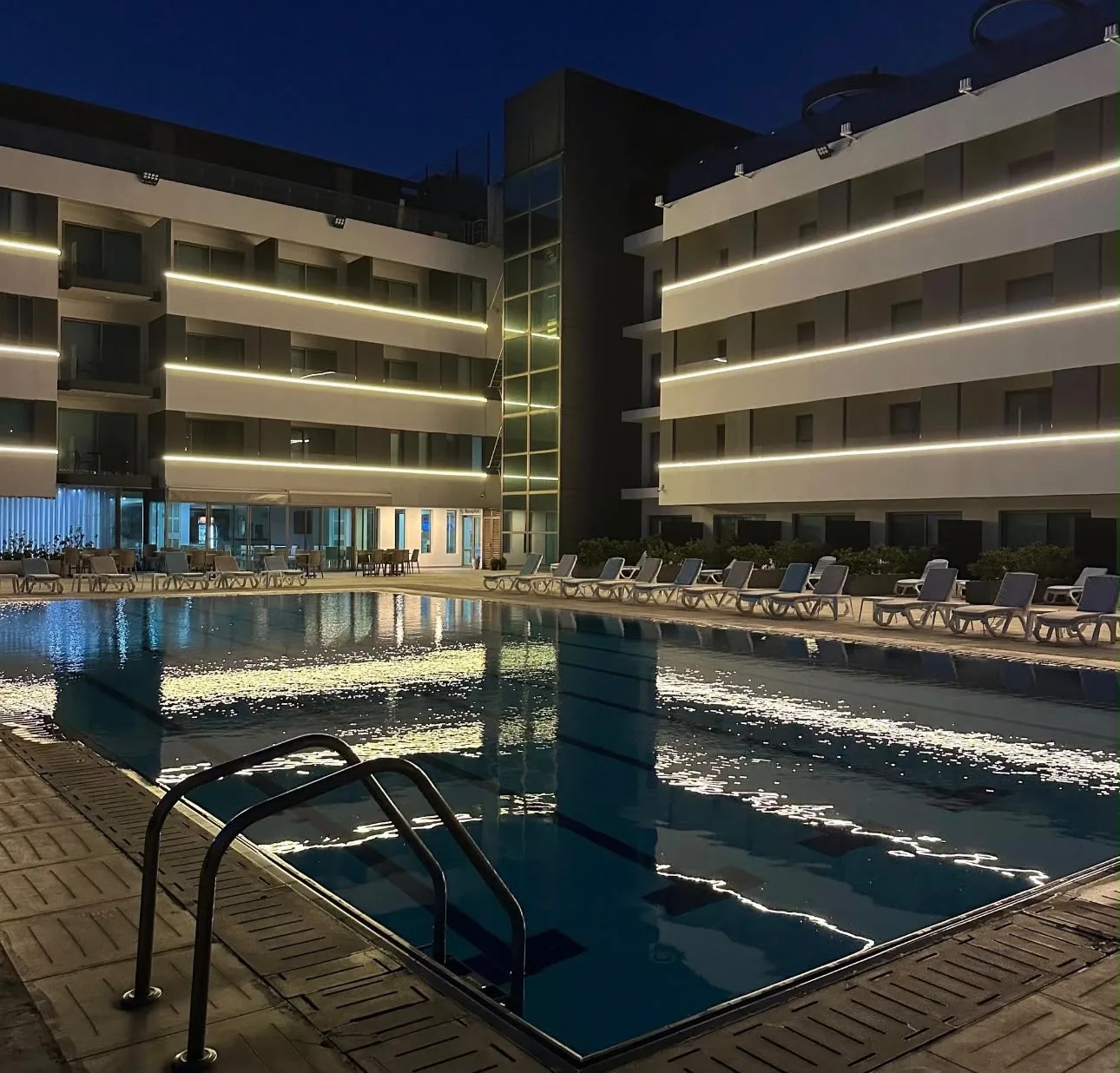 Le Six and the pool at night