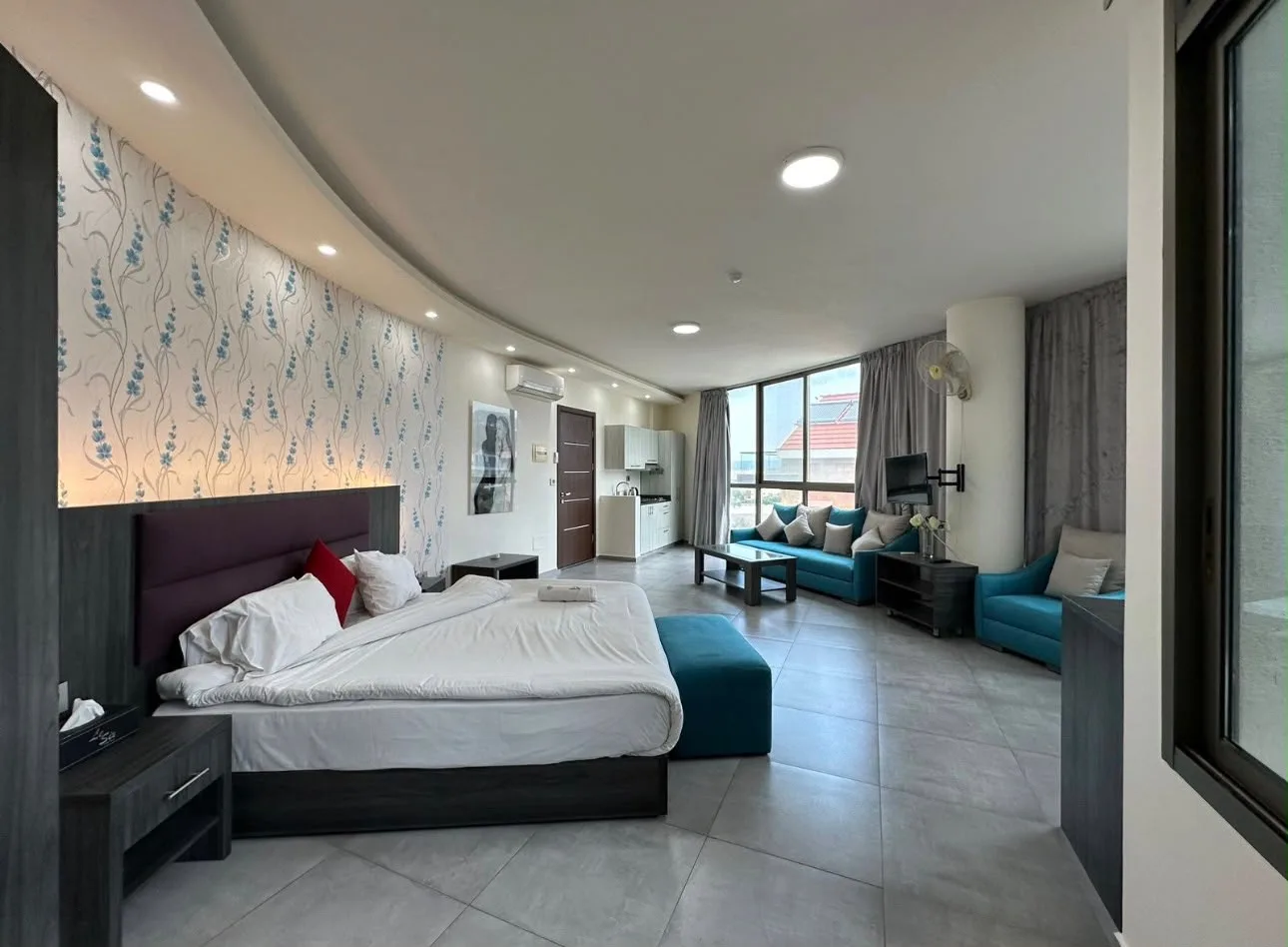 Suite with a bed and sitting area